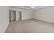 Spacious bedroom featuring neutral paint, a tray ceiling and a view to the en suite bathroom at 3212 Imperial Oaks Dr, Raleigh, NC 27614