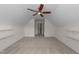 Bonus room featuring neutral paint, vaulted ceilings, and a door with bright lighting at 3212 Imperial Oaks Dr, Raleigh, NC 27614