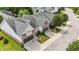 Charming two-story home features a stone facade, manicured lawn, and attached two-car garage at 3212 Imperial Oaks Dr, Raleigh, NC 27614