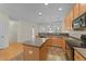 Functional kitchen with center island, tile flooring, and modern appliances at 3212 Imperial Oaks Dr, Raleigh, NC 27614