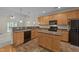 Well-lit kitchen featuring a center island, lots of cabinet space, and open to living area at 3212 Imperial Oaks Dr, Raleigh, NC 27614
