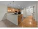 Bright kitchen boasts ample cabinets, recessed lighting, and smooth transition into the entry hall at 3212 Imperial Oaks Dr, Raleigh, NC 27614