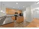 Spacious kitchen with wood cabinets, island, modern appliances and tile flooring at 3212 Imperial Oaks Dr, Raleigh, NC 27614
