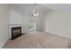Comfortable living room featuring a cozy fireplace, ceiling fan, and sliding glass doors to the outside at 3212 Imperial Oaks Dr, Raleigh, NC 27614