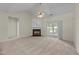 Bright living room with vaulted ceiling, fireplace, ceiling fan, and access to backyard at 3212 Imperial Oaks Dr, Raleigh, NC 27614