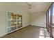 Relaxing screened porch featuring neutral tones, a ceiling fan, and sliding door access to outdoor views at 3212 Imperial Oaks Dr, Raleigh, NC 27614