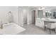 Primary bathroom showcasing double vanity, makeup counter, and tiled floors at 3621 Bailey Lake Dr, Fuquay Varina, NC 27526