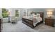Spacious primary bedroom features large windows, neutral carpet, and classic furnishings at 3621 Bailey Lake Dr, Fuquay Varina, NC 27526