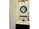 Bathroom sink with a vanity and a decorative mirror on the wall with lighting at 3648 Sleepy Hollow, Wake Forest, NC 27587