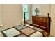 Cozy bedroom with a bed, dresser, lamp, and a natural light window at 3648 Sleepy Hollow, Wake Forest, NC 27587