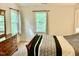 Well-lit bedroom featuring a cozy bed, dresser, and natural light windows at 3648 Sleepy Hollow, Wake Forest, NC 27587