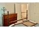 Charming bedroom with a traditional bed, dresser, and access to other areas at 3648 Sleepy Hollow, Wake Forest, NC 27587
