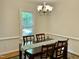 Dining room table with a view of the backyard through a large window at 3648 Sleepy Hollow, Wake Forest, NC 27587