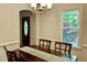 Dining room with chandelier and view of front door and large side window at 3648 Sleepy Hollow, Wake Forest, NC 27587