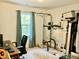 Bright exercise room with workout equipment and large natural light window at 3648 Sleepy Hollow, Wake Forest, NC 27587