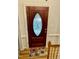 Front door with decorative glass and colorful rug on hardwood floors at 3648 Sleepy Hollow, Wake Forest, NC 27587