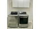 Well-lit laundry room with modern washer and dryer units, plus storage at 3648 Sleepy Hollow, Wake Forest, NC 27587