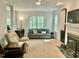 Inviting living room featuring a fireplace, sofa, and plenty of natural light at 3648 Sleepy Hollow, Wake Forest, NC 27587