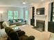 Bright and spacious living room with fireplace and comfortable seating arrangement at 3648 Sleepy Hollow, Wake Forest, NC 27587