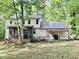 The back of the home features a screened porch overlooking a spacious backyard in natural surrounds at 3648 Sleepy Hollow, Wake Forest, NC 27587
