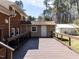 Backyard deck features a storage building; great for entertaining and enjoying outdoor living at 3818 Hillgrand Dr, Durham, NC 27705