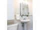 Bathroom featuring a pedestal sink, modern mirror, and a convenient walk-in shower at 3818 Hillgrand Dr, Durham, NC 27705