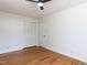 Bedroom featuring hardwood floors and a closet with bi-fold doors at 3818 Hillgrand Dr, Durham, NC 27705