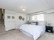 Bedroom with a large bed, neutral carpet, and decor, offering a cozy, inviting space at 3818 Hillgrand Dr, Durham, NC 27705