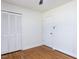 Bedroom featuring hardwood floors and a closet with bi-fold doors at 3818 Hillgrand Dr, Durham, NC 27705