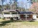 Traditional split-level home with brick and siding, featuring blue shutters and a well-manicured front lawn at 3818 Hillgrand Dr, Durham, NC 27705