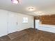 Open living area features built-in seating, white walls, new floors and modern lighting at 3818 Hillgrand Dr, Durham, NC 27705
