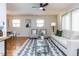 Bright living room featuring hardwood floors, a modern rug, and neutral-toned furniture at 3818 Hillgrand Dr, Durham, NC 27705