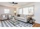 Comfortable living room with natural light, a stylish rug, and modern furnishings at 3818 Hillgrand Dr, Durham, NC 27705