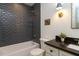 Charming bathroom featuring classic subway tile, modern fixtures, and a sleek vanity at 408 E Maynard Ave, Durham, NC 27704