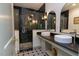 Modern bathroom featuring dual sinks, sleek vanity, and glass-enclosed shower with designer tile at 408 E Maynard Ave, Durham, NC 27704
