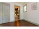Comfortable bedroom with hardwood floors featuring direct access to a full private bathroom at 408 E Maynard Ave, Durham, NC 27704