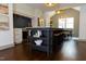 Bright kitchen features an island with seating and storage, modern lighting, and wood flooring at 408 E Maynard Ave, Durham, NC 27704