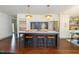 Modern kitchen with white cabinets, stainless steel appliances and large kitchen island at 408 E Maynard Ave, Durham, NC 27704