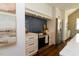 Kitchen with stainless steel appliances, white cabinets, blue subway tile backsplash, and marble countertops at 408 E Maynard Ave, Durham, NC 27704