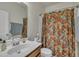 Bathroom with a white sink, vanity, and floral shower curtain at 4137 Lofty Ridge Pl, Morrisville, NC 27560