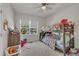 Bedroom with bunkbeds, window, and an array of toys and decorations at 4137 Lofty Ridge Pl, Morrisville, NC 27560
