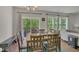 Bright dining room with natural light and a sliding door to an outdoor deck at 4137 Lofty Ridge Pl, Morrisville, NC 27560