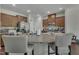 Bright kitchen with an island that has granite countertops and seating at 4137 Lofty Ridge Pl, Morrisville, NC 27560