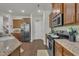 Kitchen with stainless steel appliances, wood cabinets and granite countertops at 4137 Lofty Ridge Pl, Morrisville, NC 27560