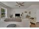 Comfortable living room with a ceiling fan, large window, plush sofa, and stylish decor at 4137 Lofty Ridge Pl, Morrisville, NC 27560