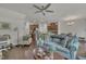 Spacious open-concept living room seamlessly connecting to the kitchen, featuring hardwood floors and ample seating at 4137 Lofty Ridge Pl, Morrisville, NC 27560