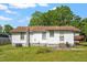 A view of the rear of the property showing the back yard and exterior at 414 N Cypress St, Wendell, NC 27591