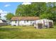 A view of the rear of the property showing the back yard and exterior at 414 N Cypress St, Wendell, NC 27591