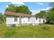 A view of the rear of the property showing the back yard and exterior at 414 N Cypress St, Wendell, NC 27591