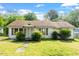 Quaint single-story home with a cozy front porch and mature landscaping, showcasing its classic charm at 414 N Cypress St, Wendell, NC 27591